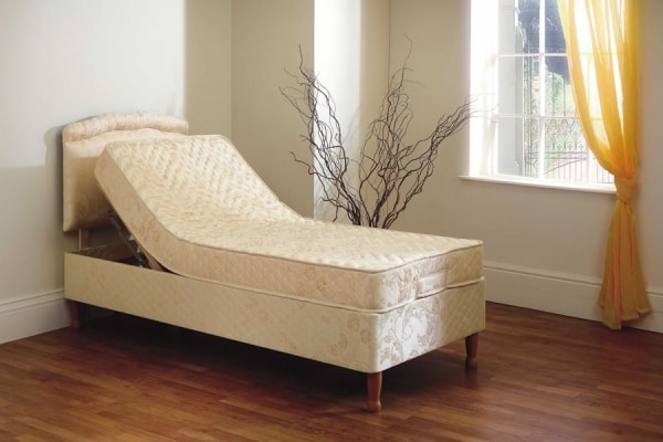 Adjustable single bed with legs
