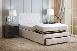 Dorchester Double bed with head flat and feet raised with the drawer open at the foot of the bed